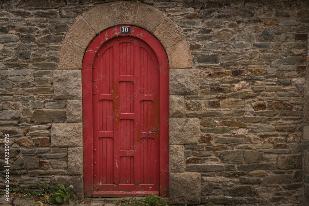 weathered door in a historic wall