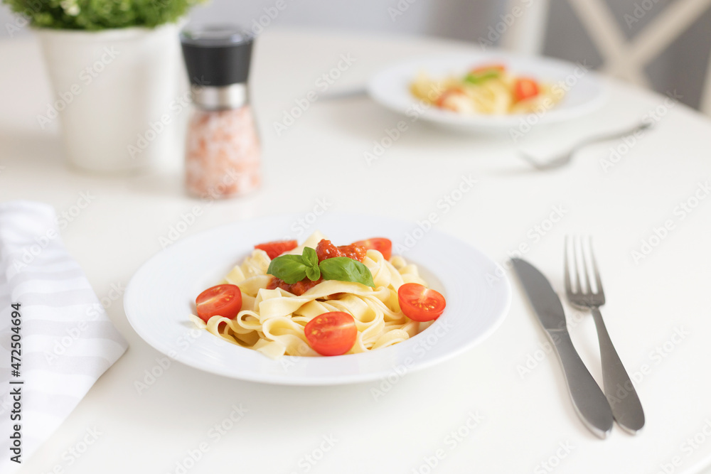 Fresh Italian pasta with cherry tomatoes, cheese and basil. Vegetarian spaghetti. Healthy food. Fresh Italian pasta with cherry tomatoes, cheese and basil. Vegetarian spaghetti. Healthy food.