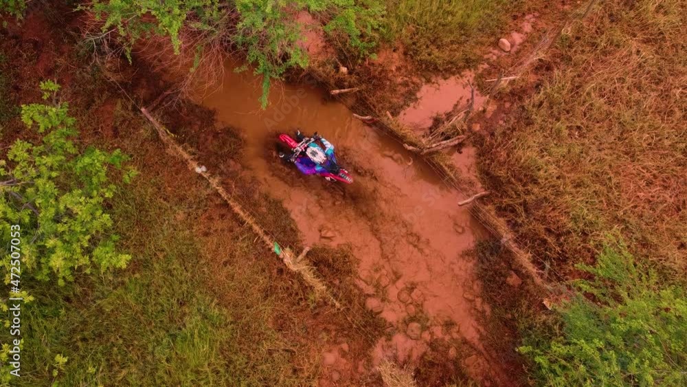 motocross rider going through the mud motocross rider going through the mud