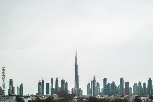 Dubai skyline with Burj Khalifa and many buildings on the horizon