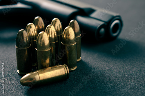 Gun, Pistol with ammunition on black background