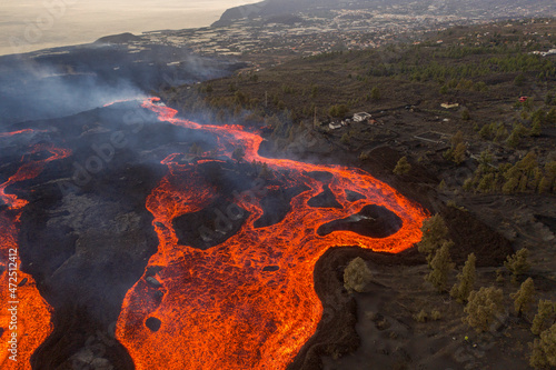 Aerial top down view of lava floating down the Volcan Cumbre Vieja, a volcano during eruption near El Paraiso town, Las Manchas, La Palma Island, Canary Islands, Spain. photo