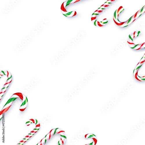 Christmas white, red, green candy canes frame with space for text.