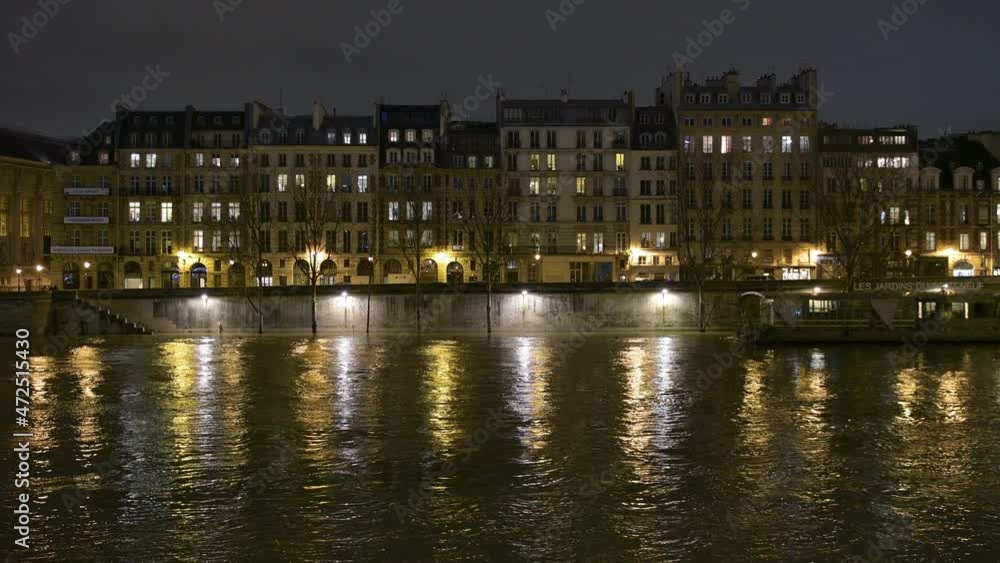 View at night at the iconic Parisian real estate French architecture and swollen river Seine embankments overflow flooding in Paris - news footage View at night at the iconic Parisian real estate French architecture and swollen river Seine embankments overflow flooding in Paris - news footage