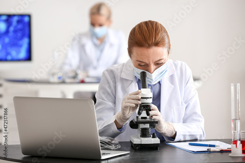 Scientist studying sample i...