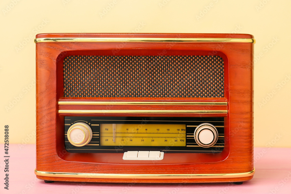 Fototapeta premium Vintage radio receiver on color background