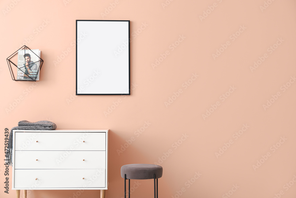 Chest of drawers and blank poster in modern room