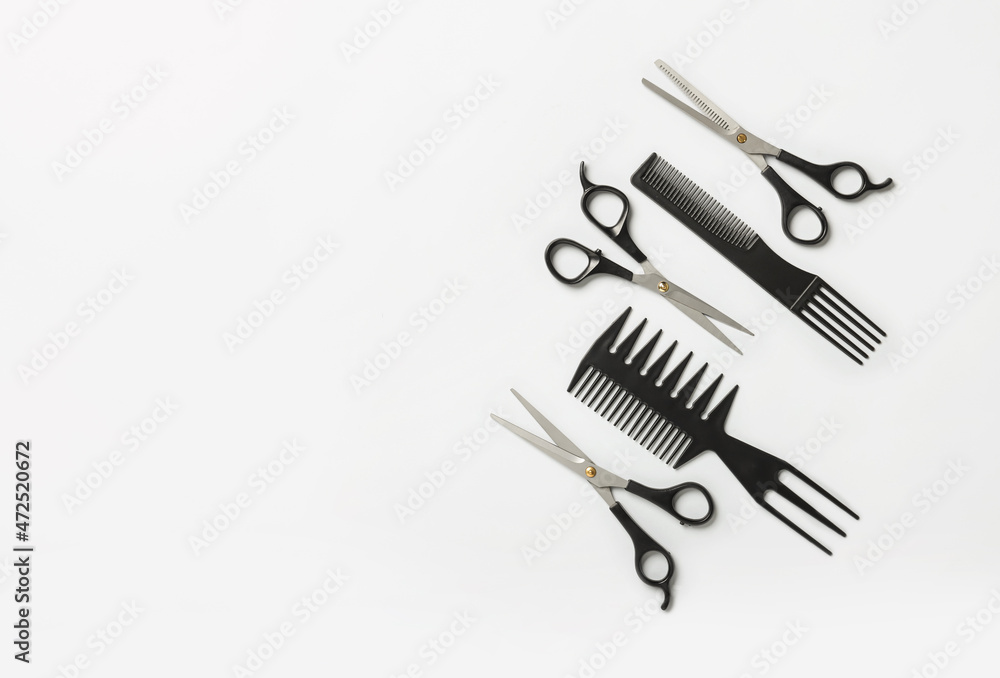 Scissors and combs on white background Scissors and combs on white background