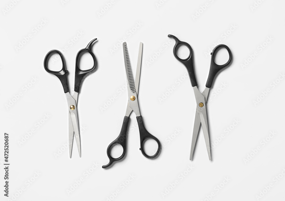 Scissors of hairdresser on white background, top view Scissors of hairdresser on white background, top view