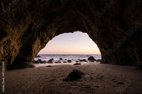 sunset from a cave in the sea