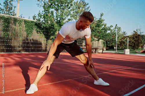 man doing exercises outdoors on the playground