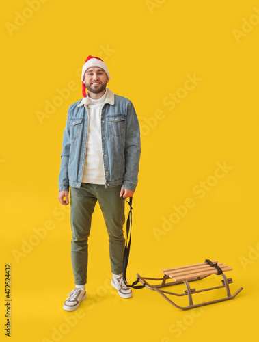 Young man in Santa hat and ...