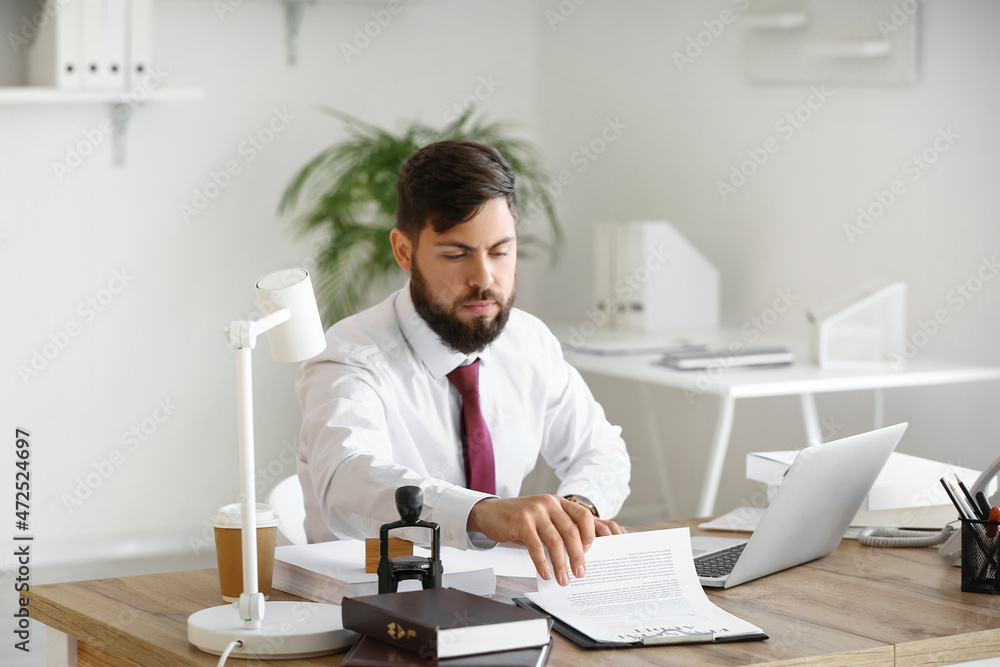 Male notary public working in office Male notary public working in office