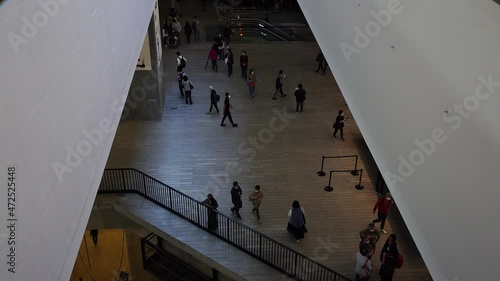 Hong Kong, China: Nov. 11, 2021,  Slow motion of people in The M+ building in the West Kowloon Cultural District, which is one of the largest museums of modern and contemporary visual culture in Hong 