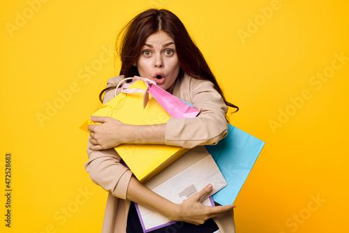 glamorous woman shopping entertainment lifestyle yellow background