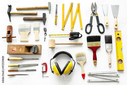 Flat lay of various technician tools isolated on white background