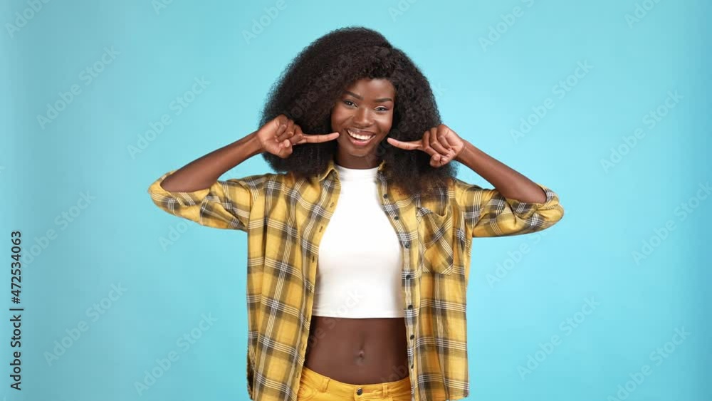 Cute lady point hand teeth modern restoration isolated blue color background Cute lady point hand teeth modern restoration isolated blue color background
