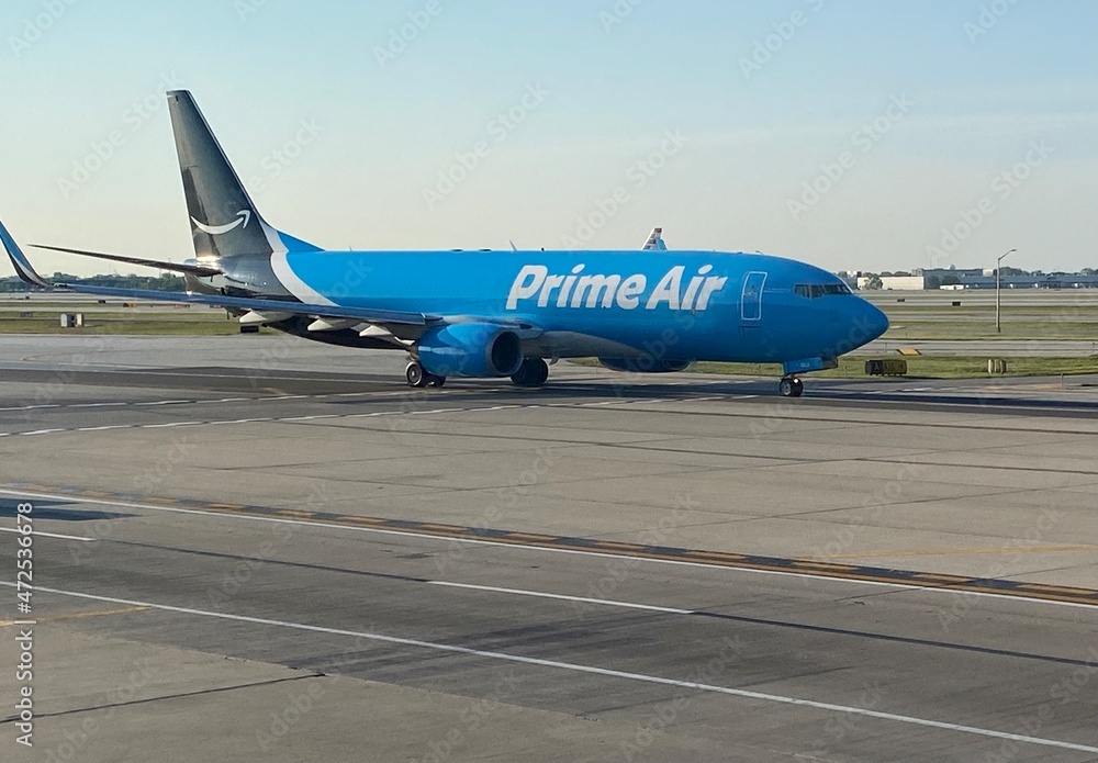 Amazon Prime Air Cargo plane on the runway at Chicago O'Hare International  Airport Photos | Adobe Stock