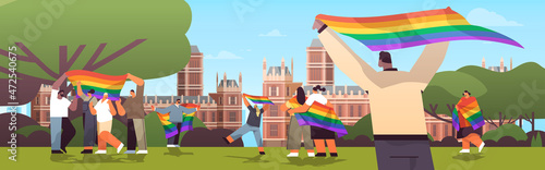 mix race people holding lgbt rainbow flags gay lesbian love parade pride festival transgender love concept