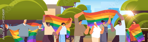 mix race people holding lgbt rainbow flags gay lesbian love parade pride festival transgender love concept