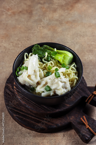 Mie Sup pangsit or Noodle wonton soup is Chinese wonton dumpling with noodle in clear soup