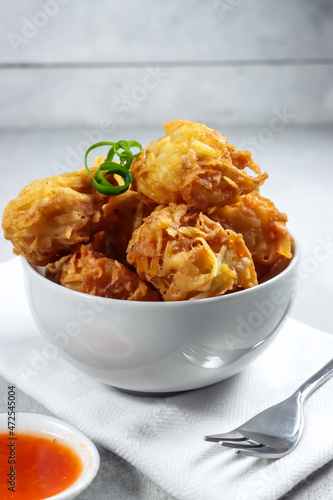 Uyen or talas goreng or fried taro is a popular fried snack from Medan, Indonesia, made from taro and shrimp photo