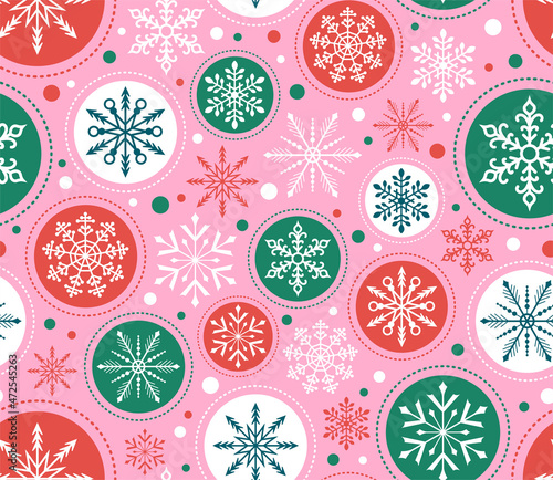 Seamless Christmas Snowflake pattern. Red, green, pink ornaments background