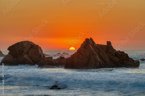 Lovely sunset on a rocky beach at the portuguese atlantic coast