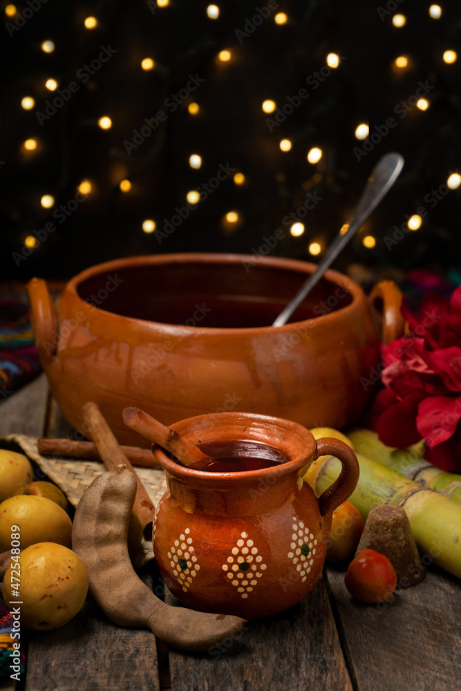 Fototapeta premium Christmas fruit punch on a wooden background