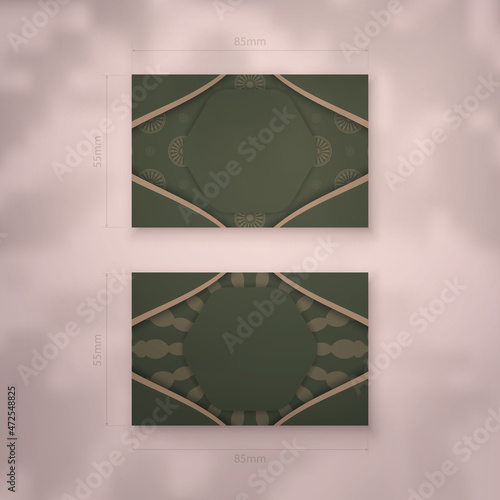 Foto A presentable business card in green with a vintage brown pattern for your contacts