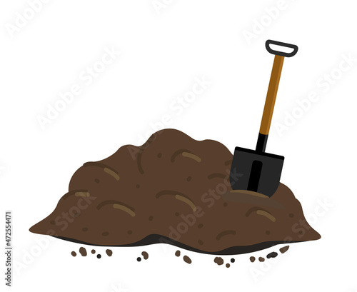 Pile of ground, manure or compost. shovel in a pile of ground. photo