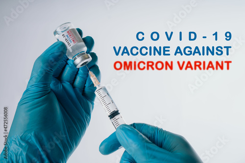Omicron variant of SARS-CoV-2. New B.1.1.529 Variant of concern. Doctor holds vaccine against new covid-19 omicron variant. New generation vaccine against.. photo
