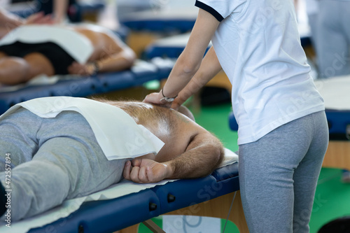 Athlete's Back Massage after Fitness Activity - Wellness and Sport