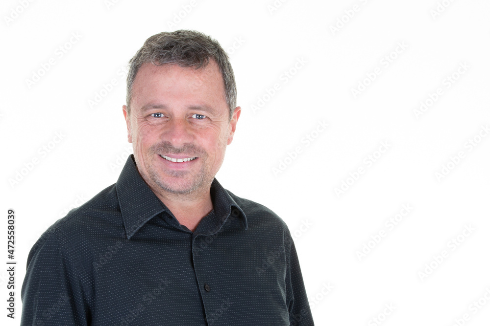 Portrait of cheerful middle aged man in casual smiling over white background and looking camera Portrait of cheerful middle aged man in casual smiling over white background and looking camera