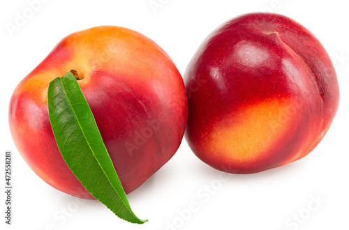 Nectarine with green leaf isolated on white background. clipping path