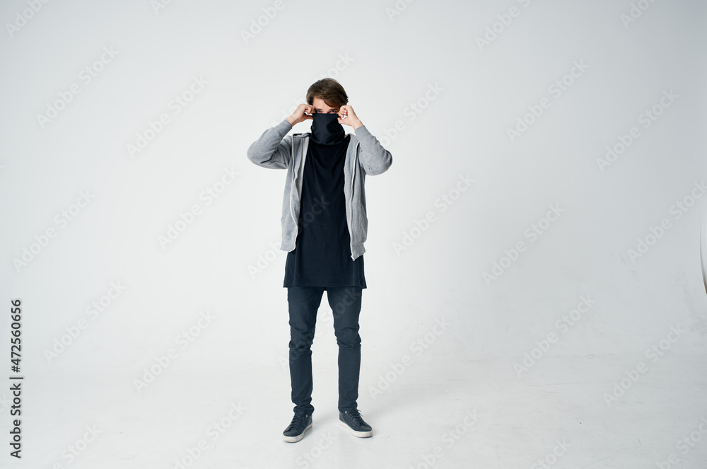masked man stealth technique robbery safety hooligan light background masked man stealth technique robbery safety hooligan light background