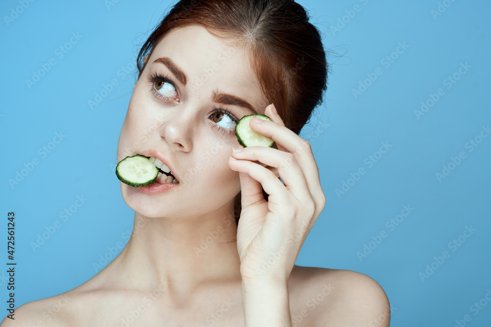 woman with bare shoulders cucumber vitamins health blue background woman with bare shoulders cucumber vitamins health blue background