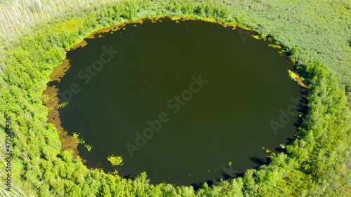 Aerial view of Bottomless  Lake in forest of Solnechnogorsk District, Moscow region. Russia. Aerial view. The lake is perfectly round and its depth is not determined. photo