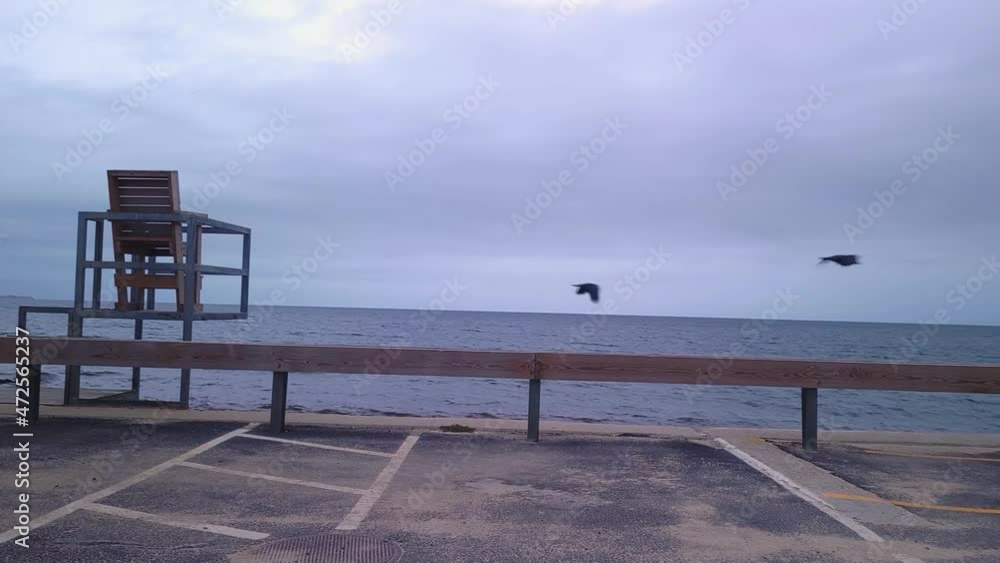 Empty chair seaside waterfront looking at the ocean Empty chair seaside waterfront looking at the ocean