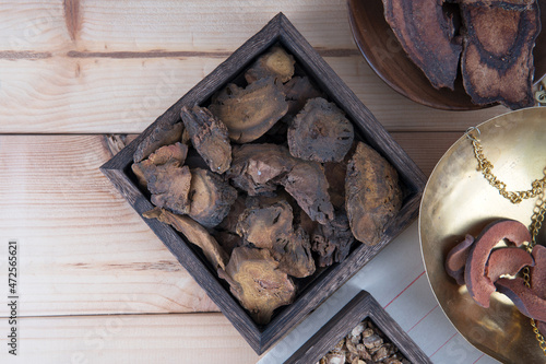 Closeup Chinese medicine rhubarb in wooden box photo