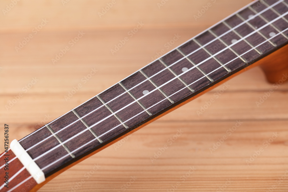 Fototapeta premium Close-up part of small musical instrument Ukulele