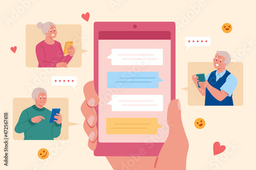 Elders texting with mobile in group