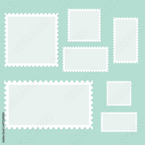 Blank postage stamps isolated on a blue background