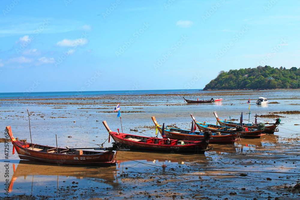 Fototapeta premium Rawai, Thailand- 02.03.2013: The wooden local traditional longtail fishing boats on sea beach in low tide time. 