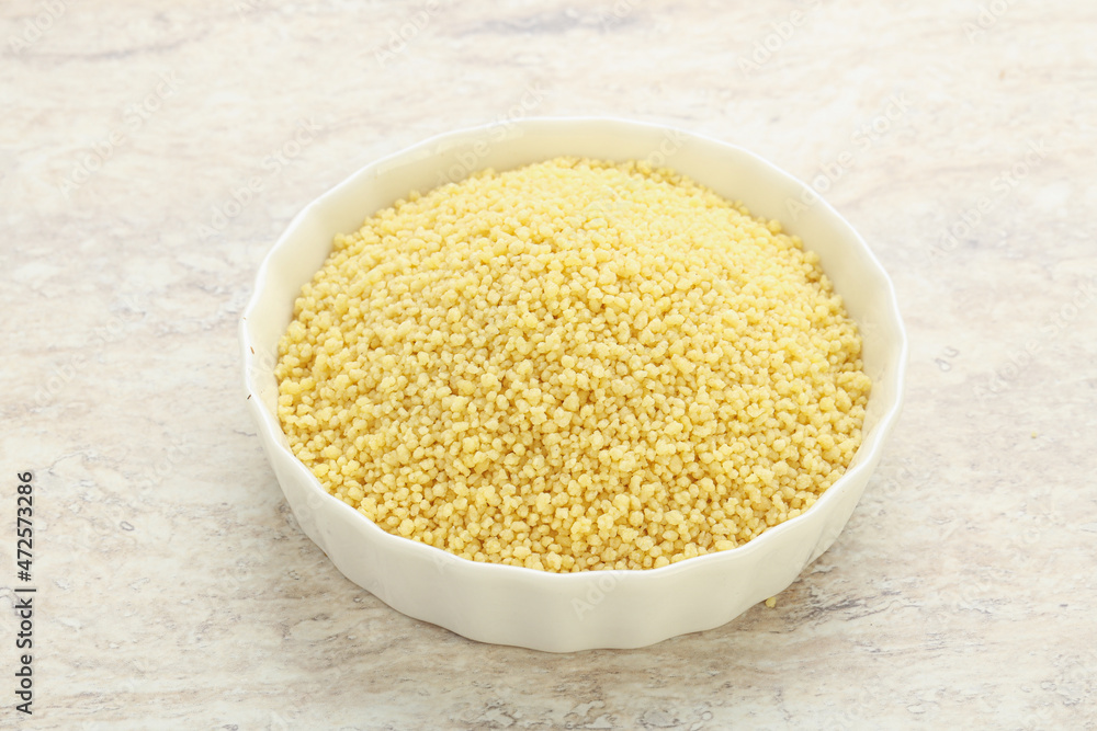 Raw couscous in the bowl Raw couscous in the bowl