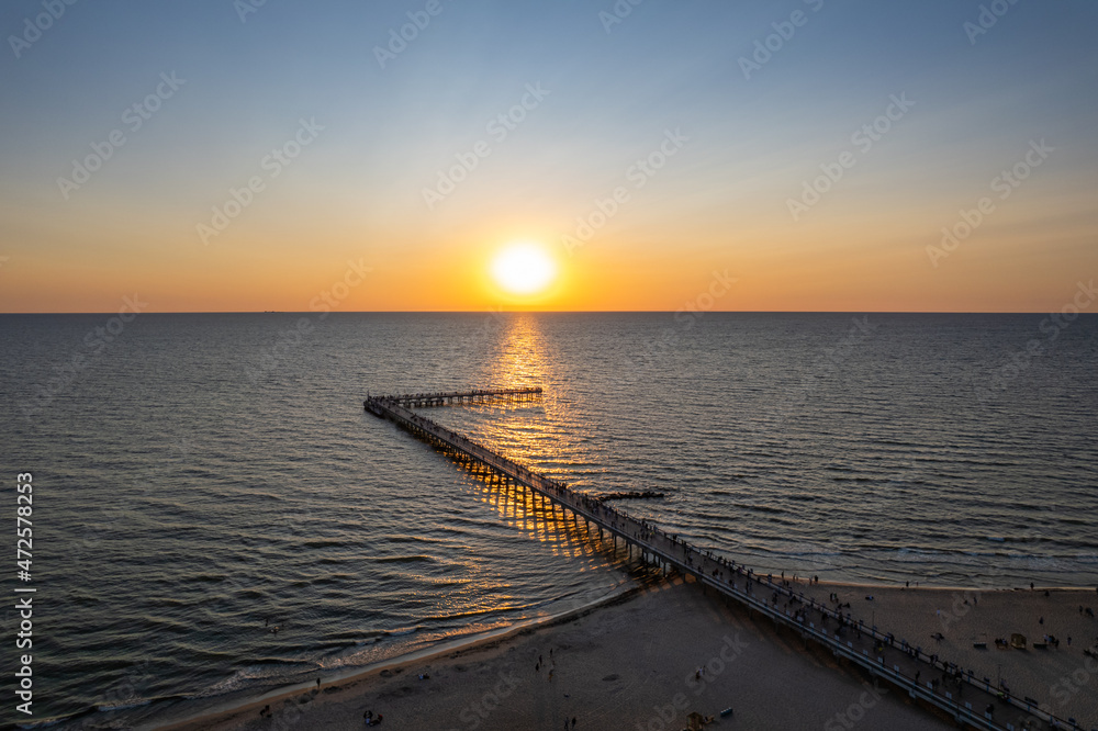 Fototapeta premium Aerial summer sunset view of sunny resort Palanga, Lithuania. Baltic sea, Palanga Bridge - Pier