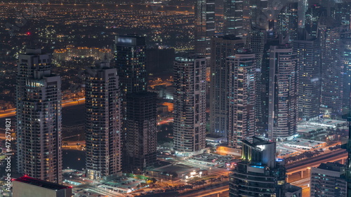 JLT skyscrapers near Sheikh Zayed Road aerial night timelapse. Residential buildings