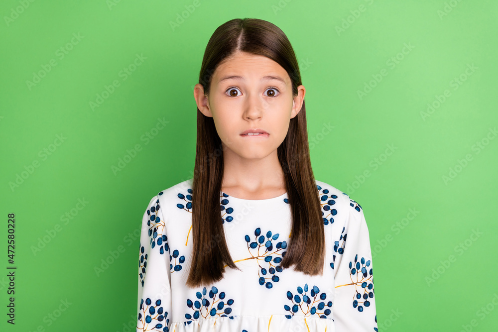 Fototapeta premium Portrait of anxious horrified schoolkid bite lips worry spring study exam isolated over green color background