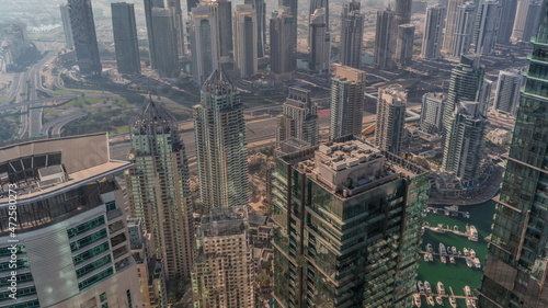 JLT and Dubai Marina skyscrapers intersected by Sheikh Zayed Road all day timelapse