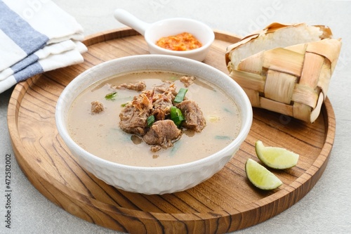 Coto Makassar, traditional food from Makassar, South Sulawesi. made from beef offal mixed with beef, seasoned with specially formulated spices. Usually served with Burasa or Ketupat ( rice cake ).
 photo
